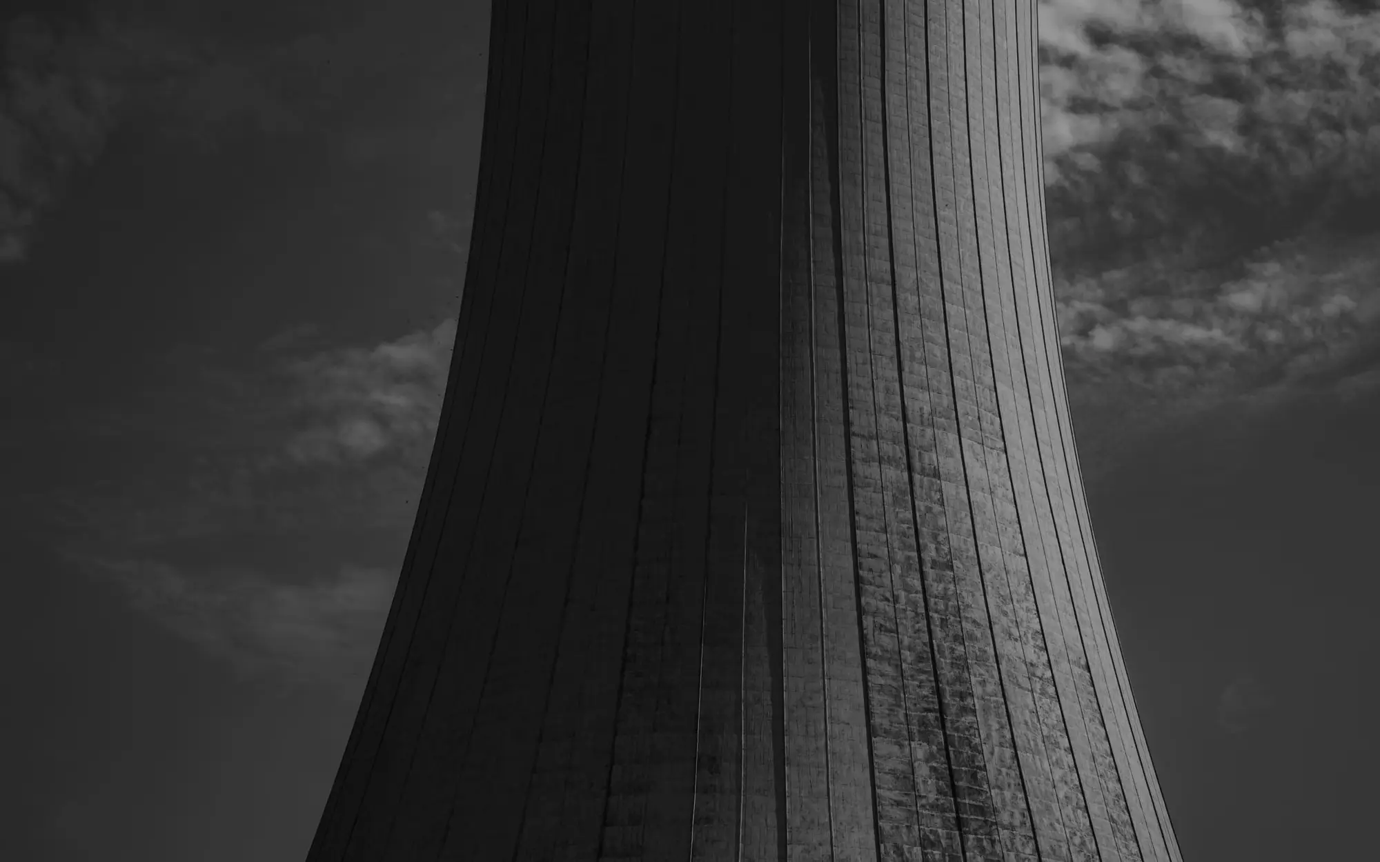 Cooling tower against a cloudy sky